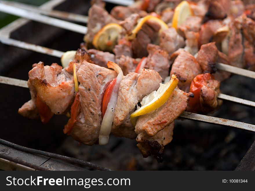 Shish kebab preparation on a brazier.