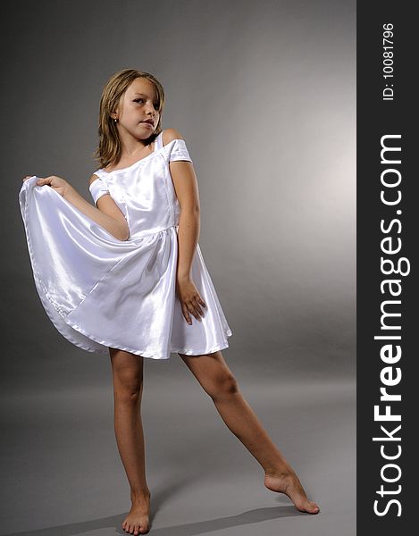 Elegant model with white dress in studio