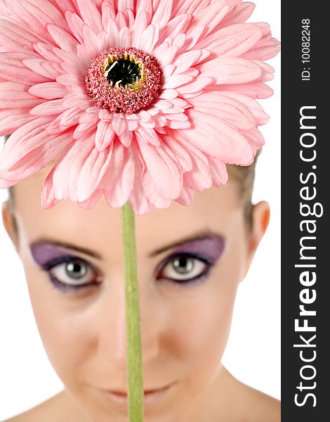 Female model holding up a flower with the focus on the flower. Female model holding up a flower with the focus on the flower.