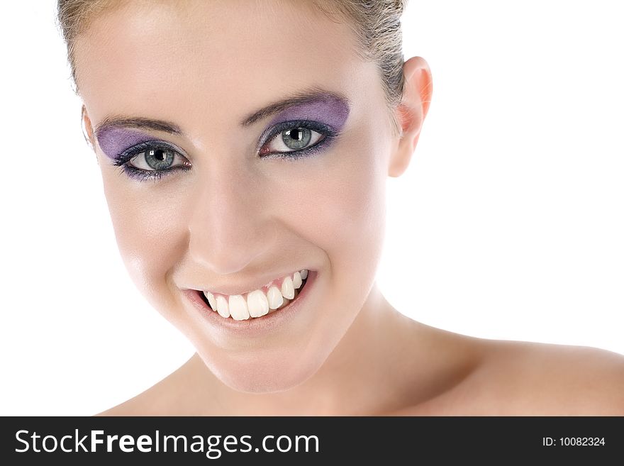 Female model with strong eye makup smiling on white background. Female model with strong eye makup smiling on white background