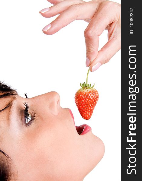 Close up of woman eating a strawberry. Close up of woman eating a strawberry