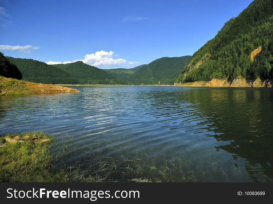 Vidraru artificial lake in the Carpathian mountains of Romania. Vidraru artificial lake in the Carpathian mountains of Romania