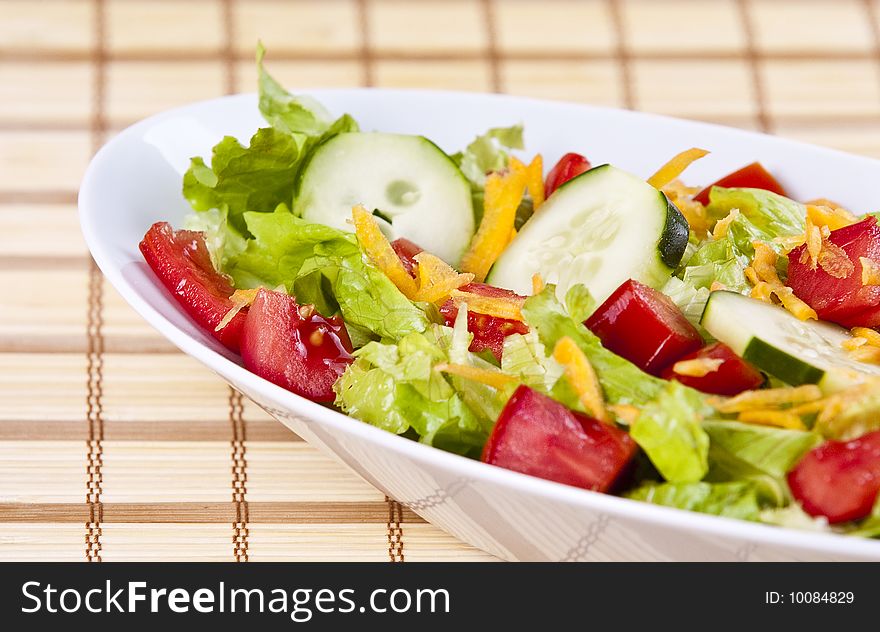 Fresh salad with lettuce tomato and cucumber