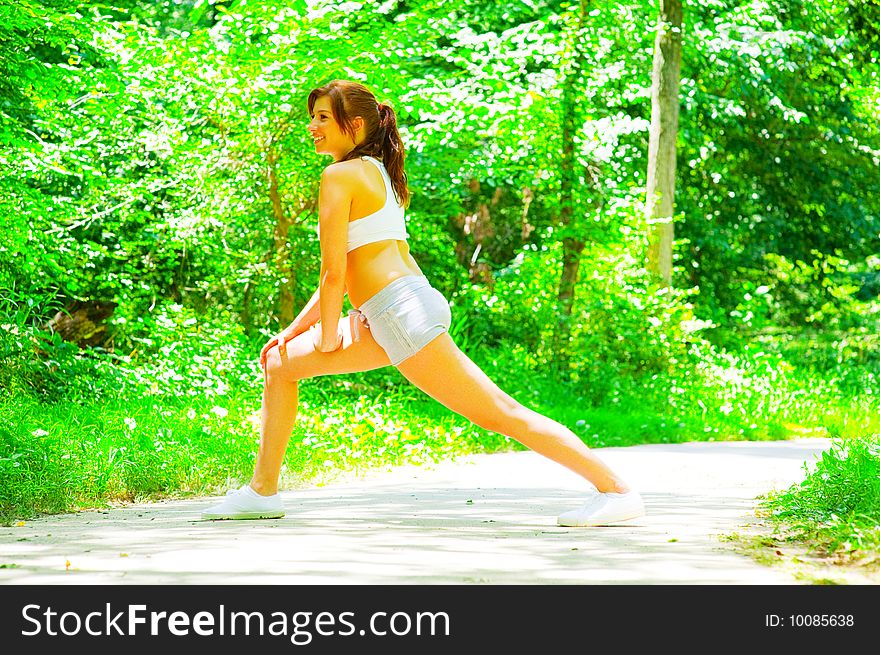 Woman Runner In The Woods