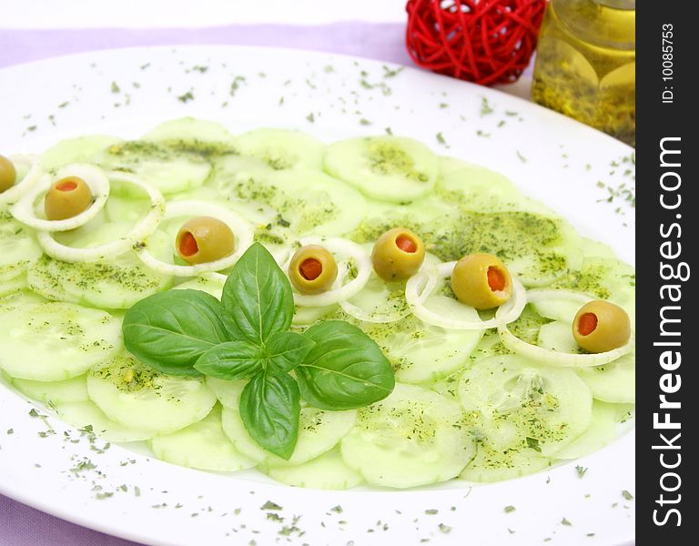 A fresh salad of cucumbers with onions and olives. A fresh salad of cucumbers with onions and olives