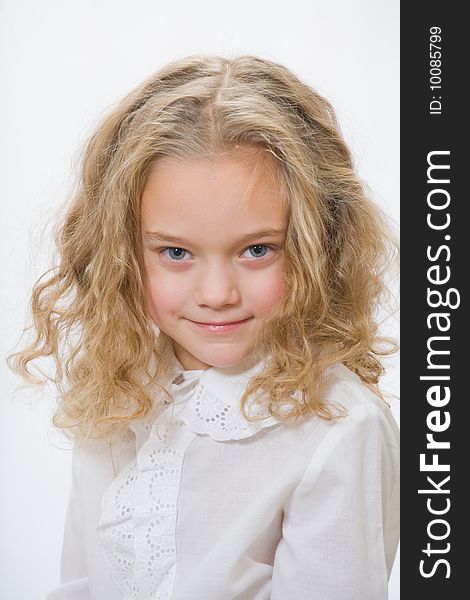 Portrait of the attractive little girl on a white background