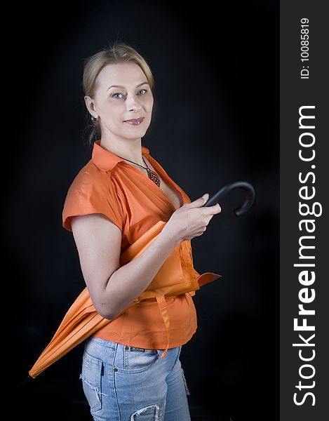 Beautiful lady with umbrella on black background