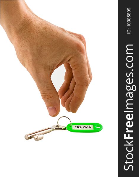 A hand reaching for a key. A hand reaching for a key