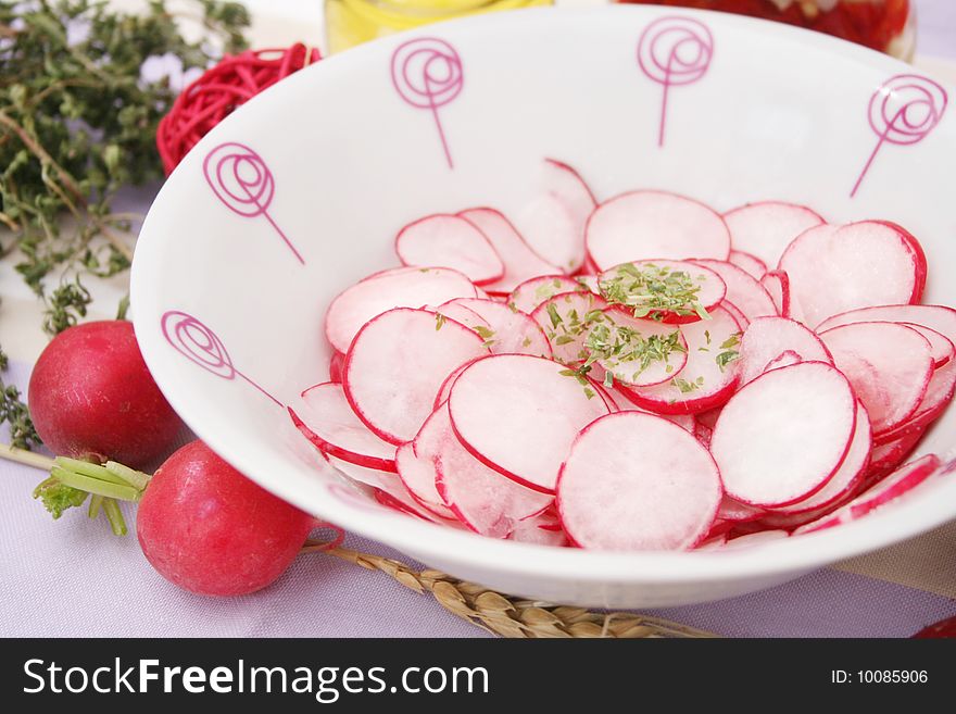 A fresh salad of red radish in a bowl