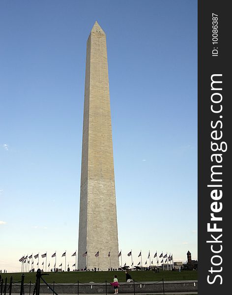 The Washington Monument with flags waving it the breeze. The Washington Monument with flags waving it the breeze