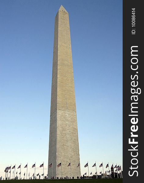 The Washington Monument with flags waving it the breeze. The Washington Monument with flags waving it the breeze
