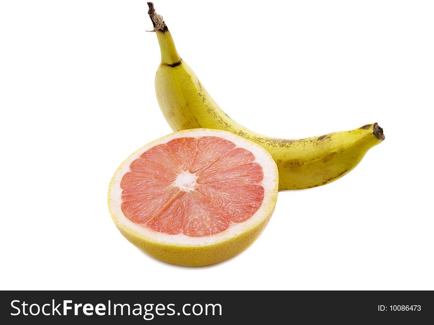 Half of a grapefruit and banana isolated on white. Half of a grapefruit and banana isolated on white