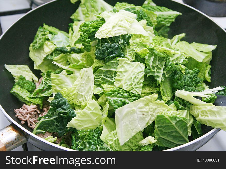 A fresh stew of green cabbage with meat