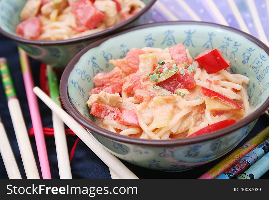 A stew of asian noodles with vegetables. A stew of asian noodles with vegetables