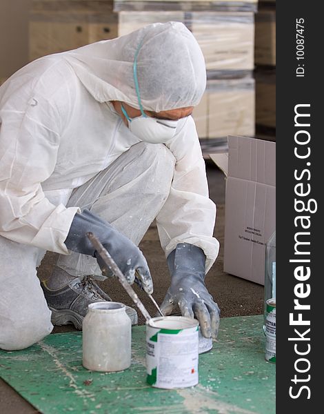 A painter at work in his construction site