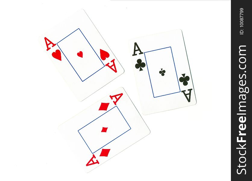 Playing cards of different colors on the table isolated on white background