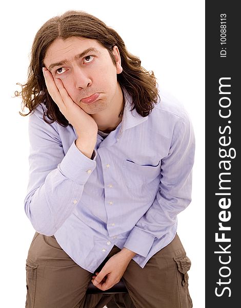 Man with pain expression white isolate portrait on a chair. Man with pain expression white isolate portrait on a chair