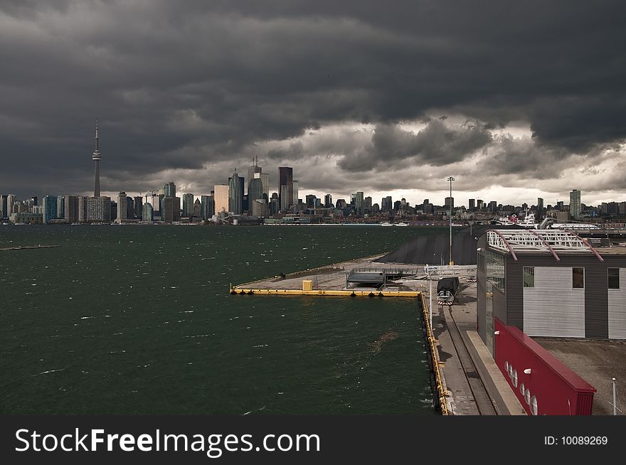A rain storm is darkening the cityscape of Toronto. 
Seen from an elevated point at the cruise terminal. A rain storm is darkening the cityscape of Toronto. 
Seen from an elevated point at the cruise terminal