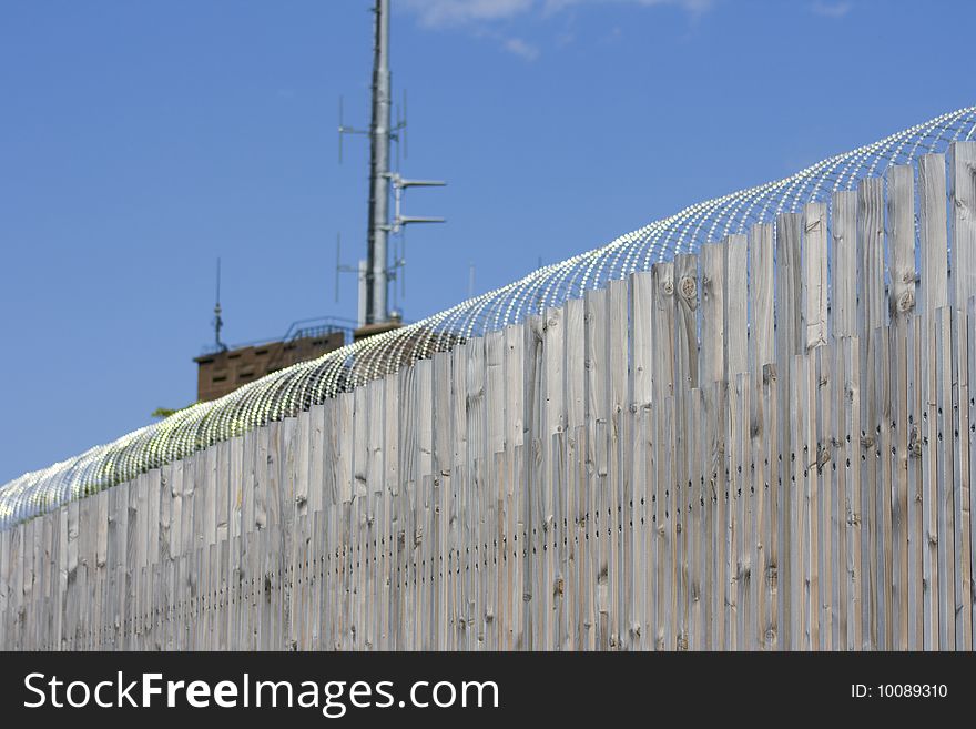 Barbed wire fence with blue sky