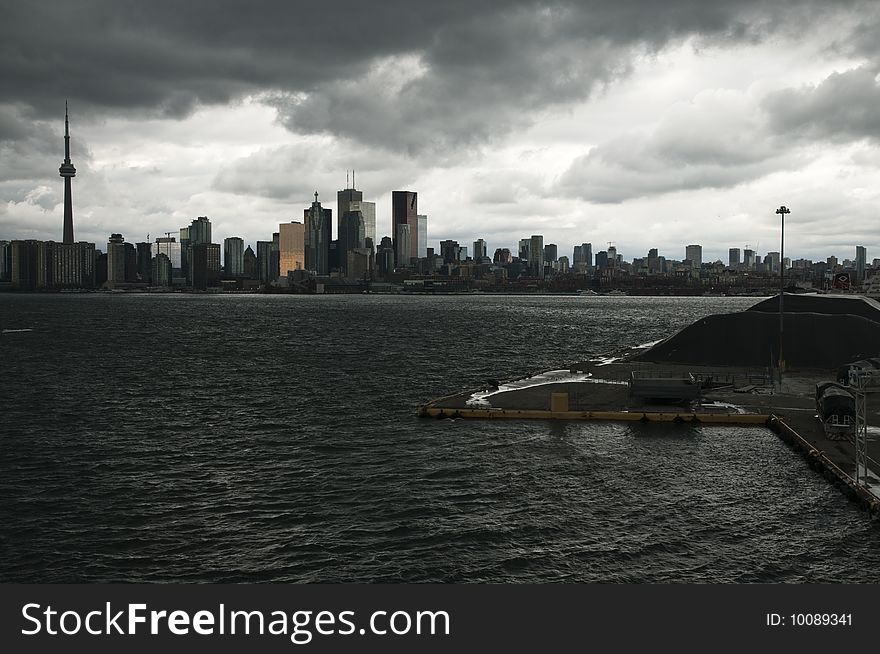 A rain storm is darkening the cityscape of Toronto. 
Seen from an elevated point at the cruise terminal. A rain storm is darkening the cityscape of Toronto. 
Seen from an elevated point at the cruise terminal