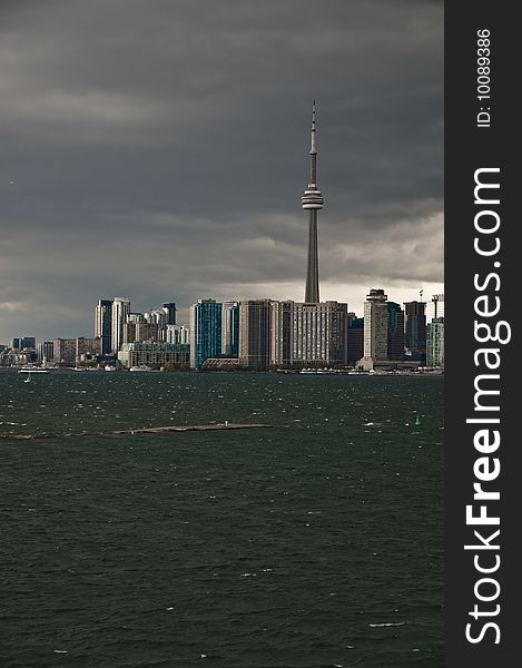 A rain storm is darkening the cityscape of Toronto. 
Seen from an elevated point at the cruise terminal. A rain storm is darkening the cityscape of Toronto. 
Seen from an elevated point at the cruise terminal