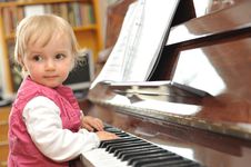 Girl Plays  Piano Stock Photo