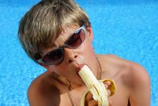 Boy With Sun Glasses Eating A Banana Stock Photo Boy With Sun Glasses Eating A Banana Stock Photo