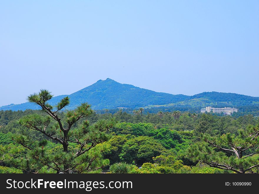 Majestic mountain with hotel at the mountain foot