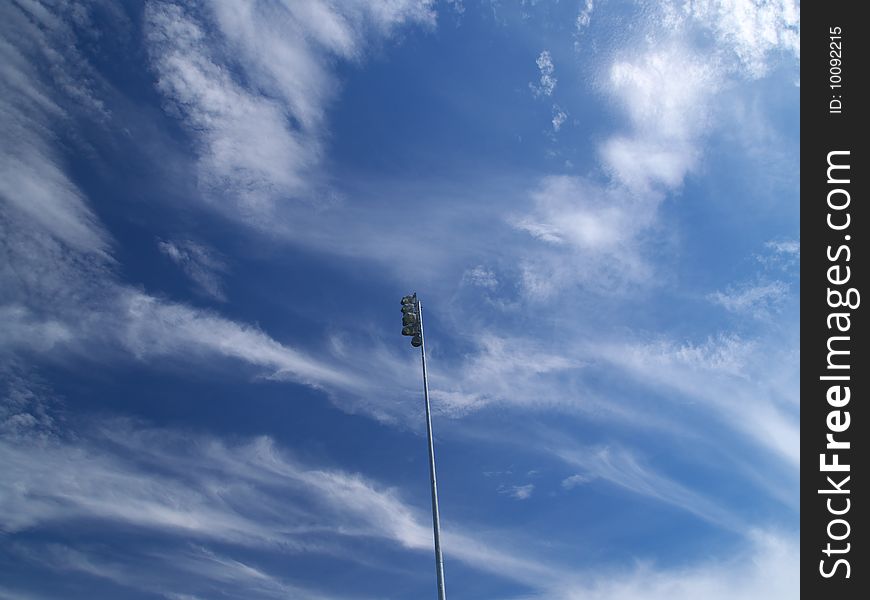 Blue cloudy sky above the soccer field. Blue cloudy sky above the soccer field