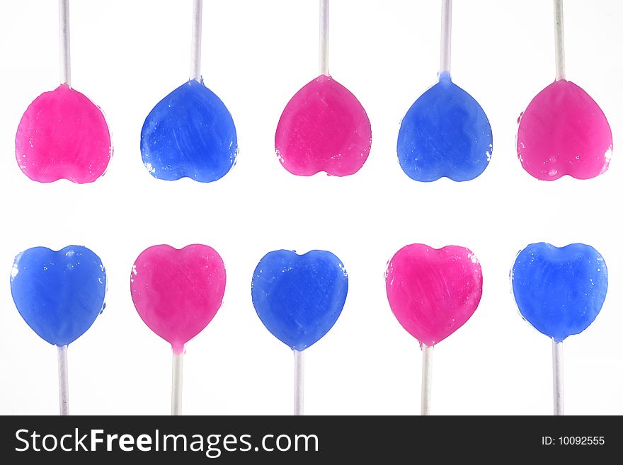 Blue and pink lollipop in group isolated