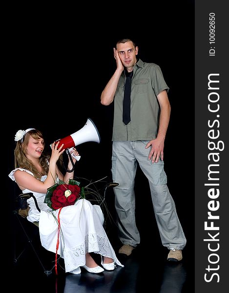 Young happy laughing wedding couple on black background, studio shot. Young happy laughing wedding couple on black background, studio shot