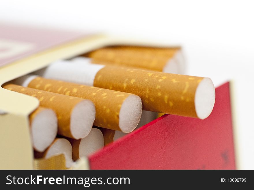 Single or pack of cigarettes with white background