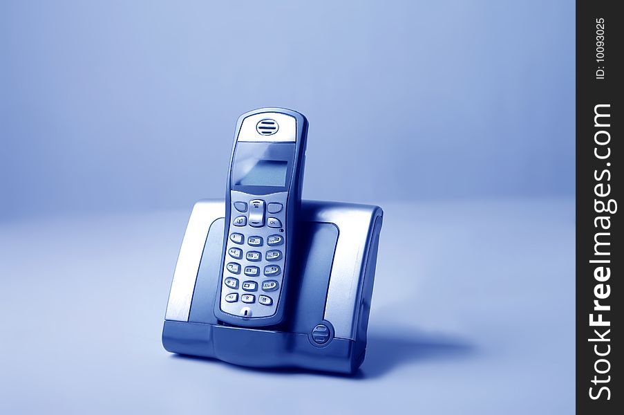 Cordless phone isolated on a blue background