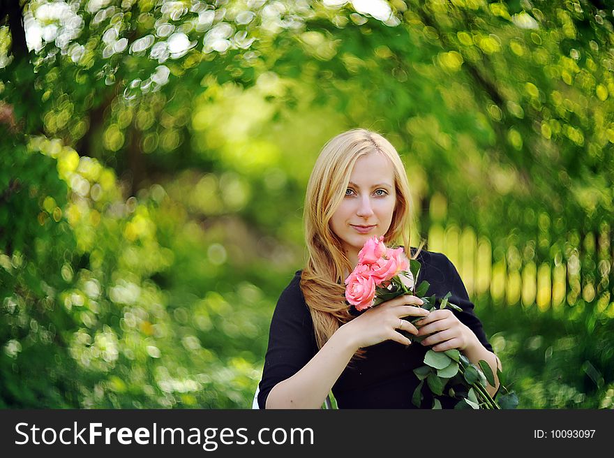 Young woman with five roses  portrait. Young woman with five roses  portrait