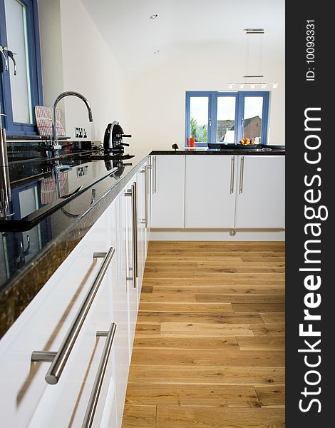 An brand new open plan kitchen and dining area in a large contemporary property. An brand new open plan kitchen and dining area in a large contemporary property