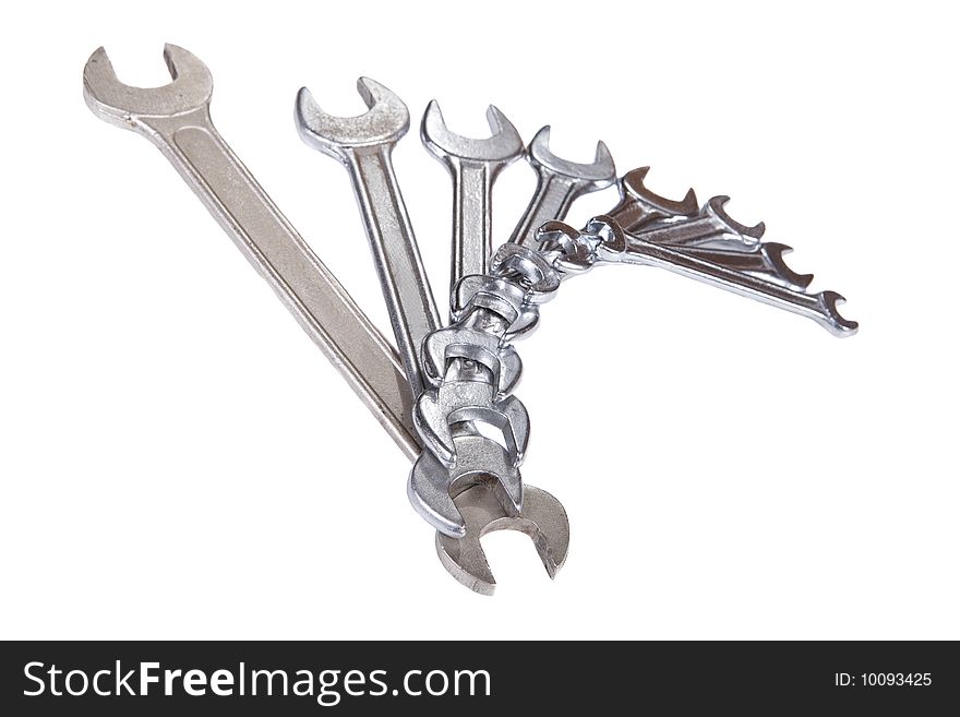 Silver spanner on white background