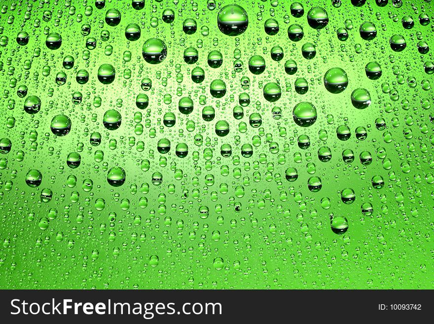 Water drops against green background. Water drops against green background