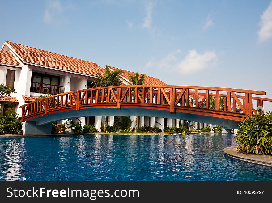 Bridge over a pool at a tropical resort in India. Bridge over a pool at a tropical resort in India.