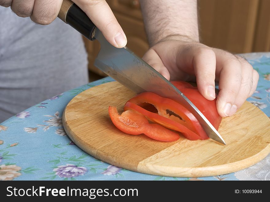 Cutting red sweet bulgarian pepper. Cutting red sweet bulgarian pepper