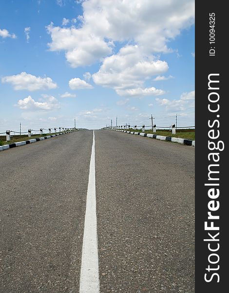 Empty highway with blue sky above