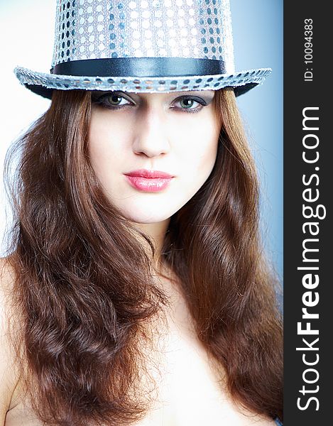 Portrait of a beautiful young girl in a brilliant hat. Portrait of a beautiful young girl in a brilliant hat