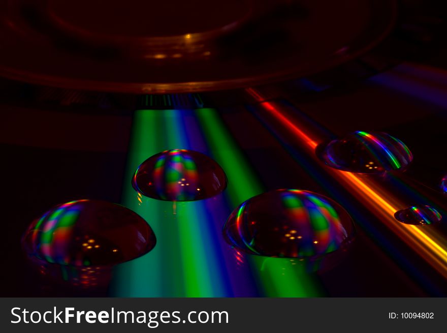 Reflected Light On Water Drops On A Disc
