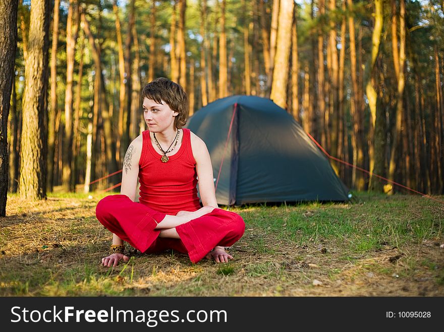 Pretty young woman relaxing in the forest