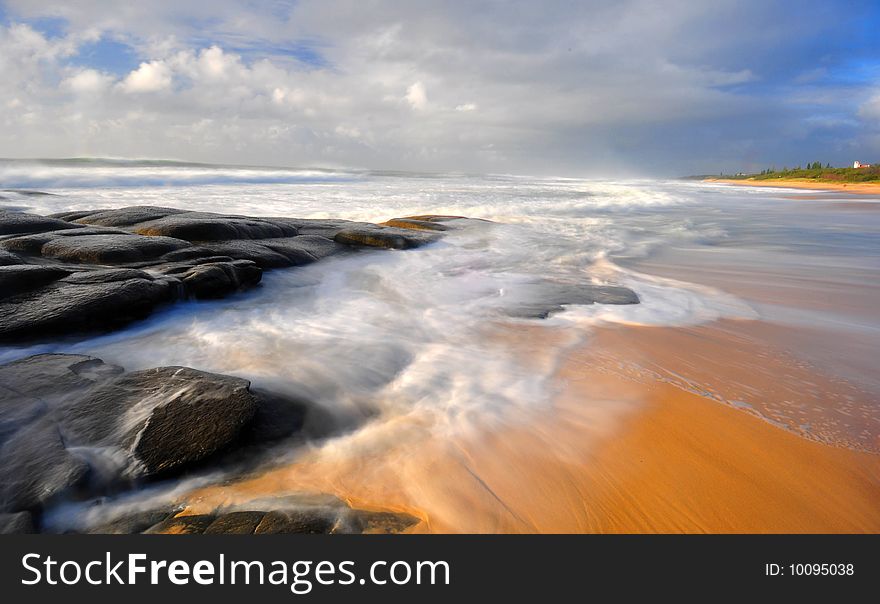 Early morning at the beach with flowing water. Early morning at the beach with flowing water