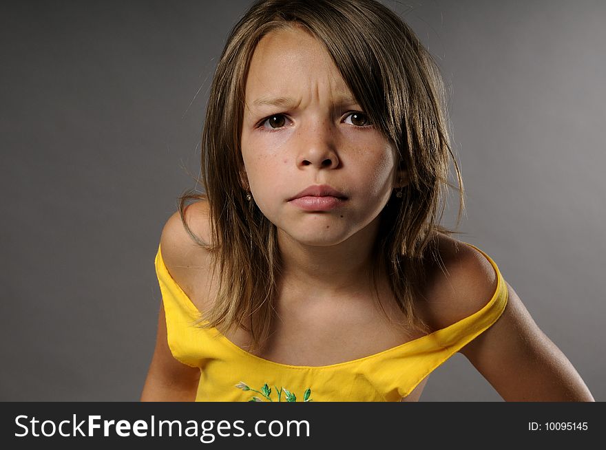 Portrait of upset girl with serious attitude