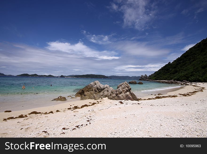 A sunny sky over a tropical beach in Okinawa, Japan