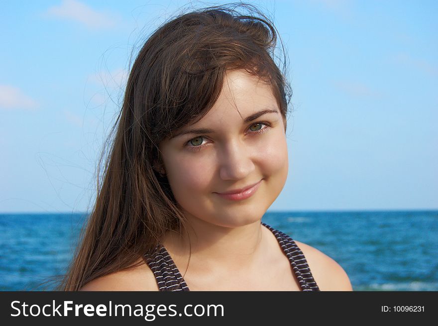 Women's portrait on sea background