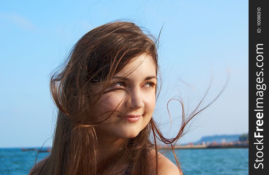 Women's portrait on sea background