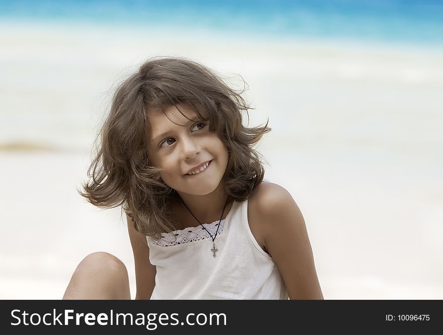 Portrait of nice little girl having fun on the beach. Portrait of nice little girl having fun on the beach