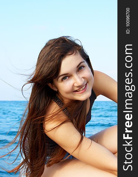 Women's portrait on sea background